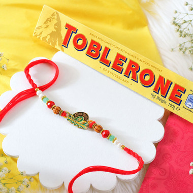 Read more about the article Krishna Bansuri Rakhi With Gourmet Hamper