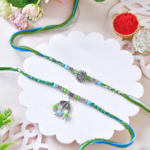 Read more about the article Blue-Green Designer Rakhi Set with Om & Peacock Charm