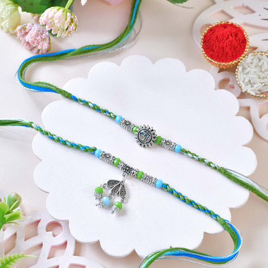 You are currently viewing Blue-Green Designer Rakhi Set with Om & Peacock Charm