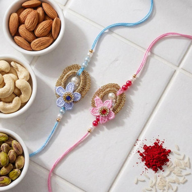 You are currently viewing Blue and pink floral design Rakhi With Dry Fruits