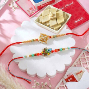 Read more about the article Set of 2 Floral Design Rakhis with Kaju katli